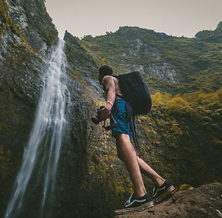 Hiker Near Waterfall