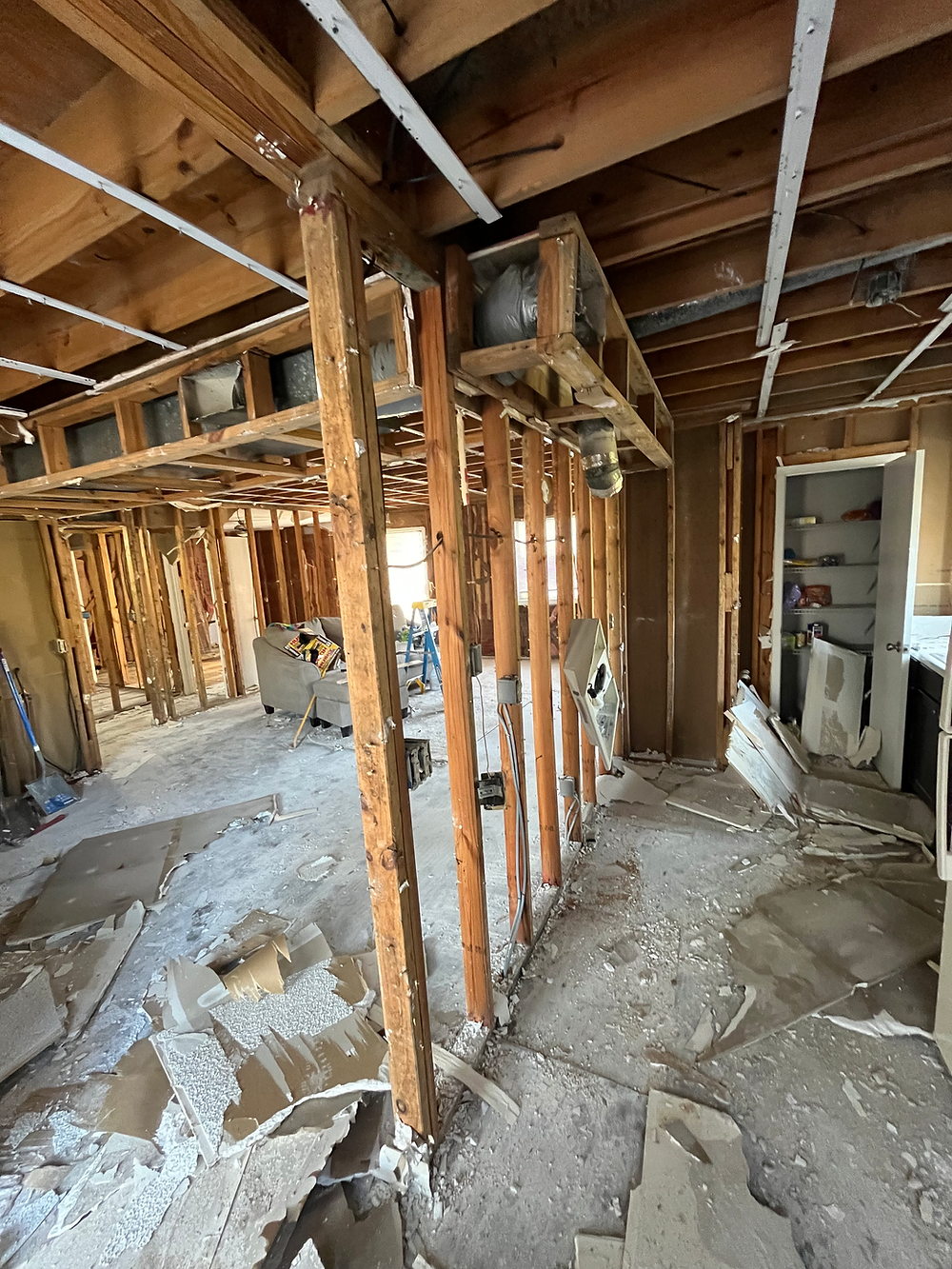 Water damage demolition with exposed framing and structural repairs