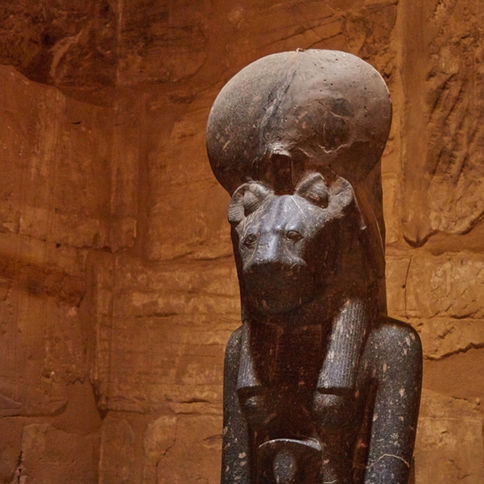 Ancient Egyptian Sekhmet statue in a stone temple