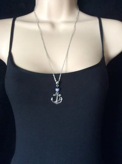 Thumbnail: This beautiful necklace has been hand made in a nautical theme including an anchor on a blue and white stripe acrylic bead.