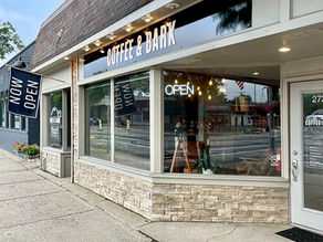 Coffee & Bark Berkley storefront with Now Open banner celebrating the coffee shop’s opening in Berkley, Michigan