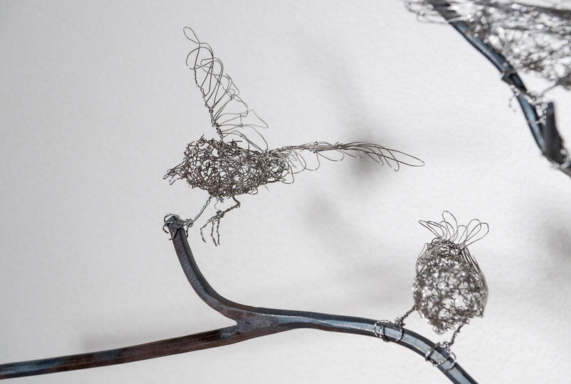 Sculpture of steel woven sparrows on steel branches and found objects. Artist Shona Rapira-Davies.