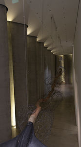 Sculpture of whales tail with a backbone of stripped pohutukawa backbone, wound around stones of woven steel and a head of the kauri tree.
