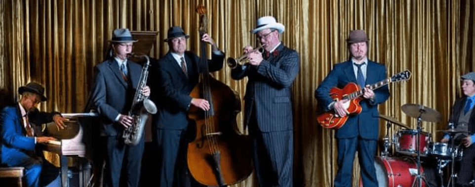 Traditional swing in Kansas City's jazz heritage style, with a full horn section and rhythm section.