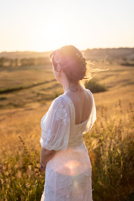 Golden hour photograph of bride at New Hall, Winchelsea, Sussex, UK.