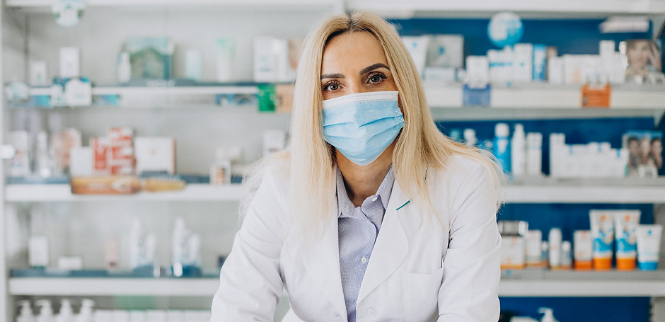 woman-working-at-pharmacy-and-wearing-co