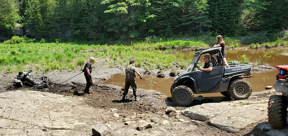 segway fugleman pulling can-am from mud