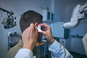 doctor-doing-ear-examination-of-young-patient-2021-08-31-21-16-59-utc.jpg