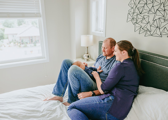 Family holding newborn during photoshoot in penticton_edited.jpg