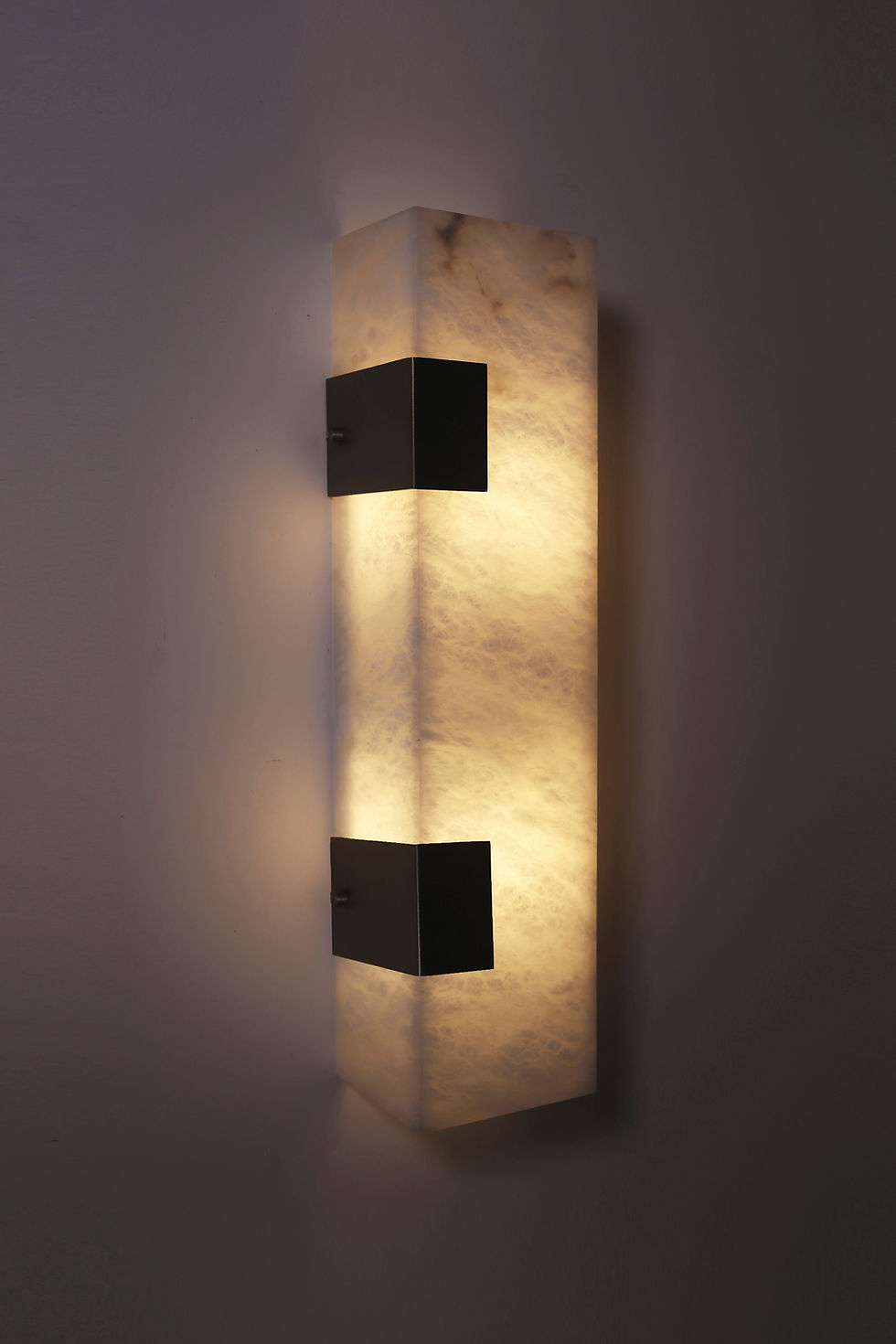 Thumbnail: Ponti alabaster sconce finished in blackened brass, 2 clip, side view, light on
