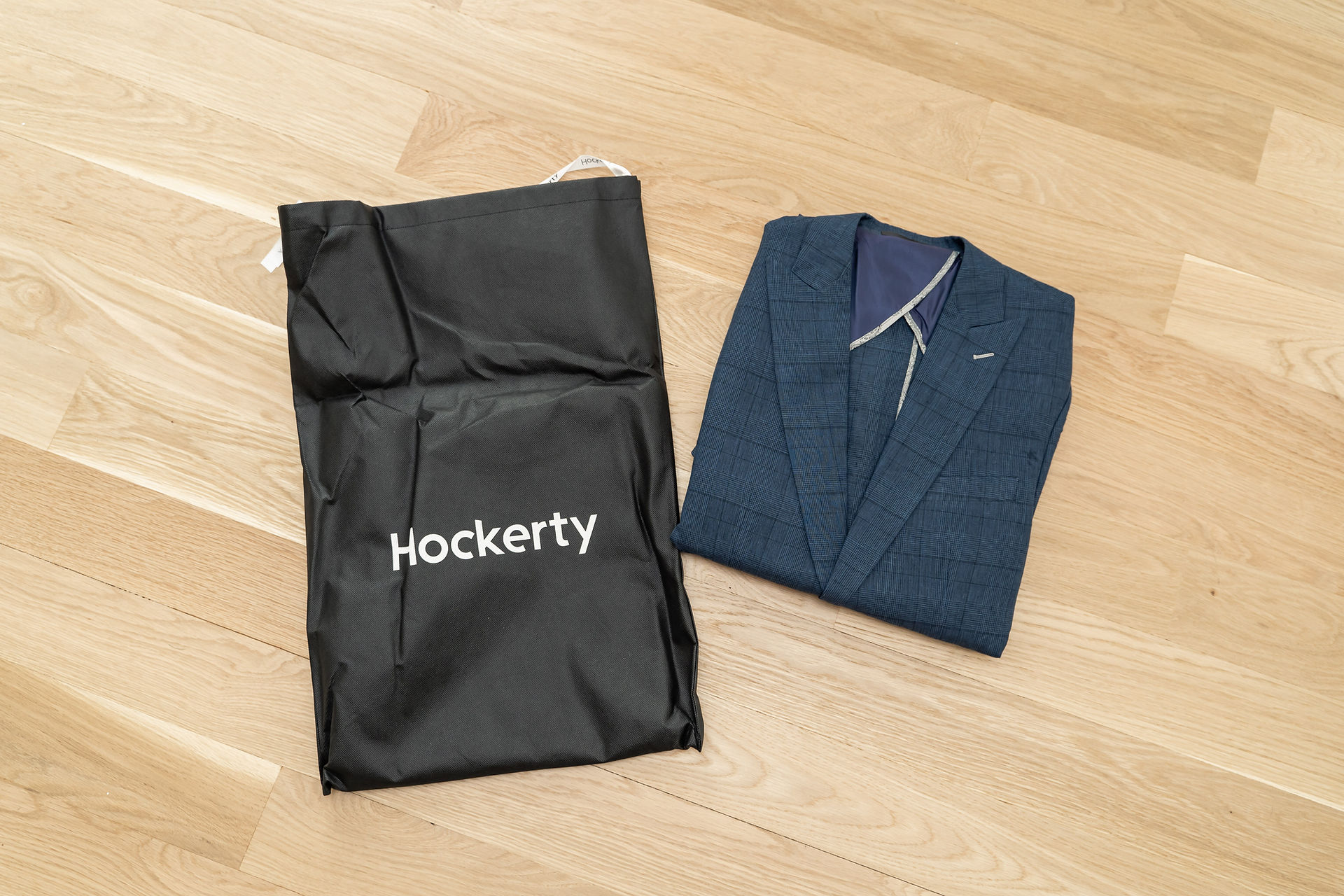 Hockerty custom suiting packaging folded