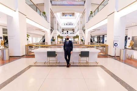 Dapper Professional standing on the inside of the 900 North Michigan Shops