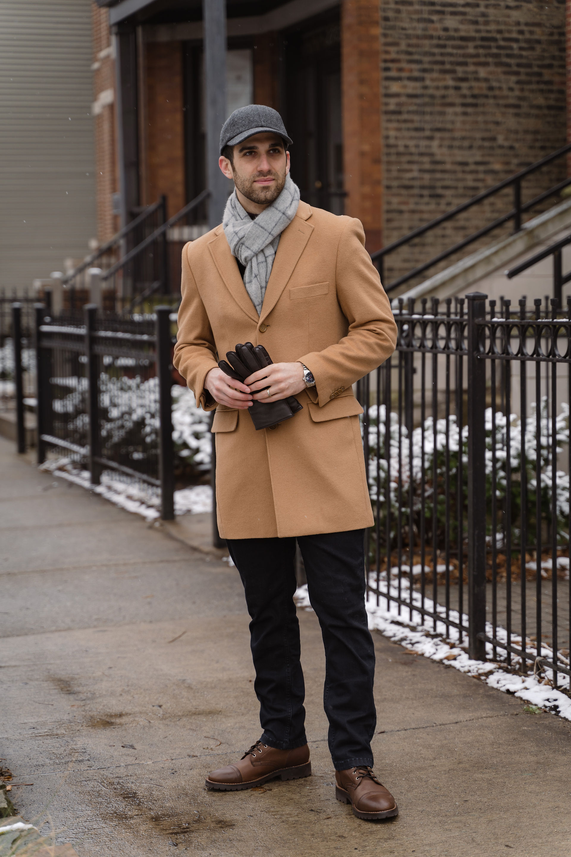 A stunning camel topcoat with a scarf and Vandre hat