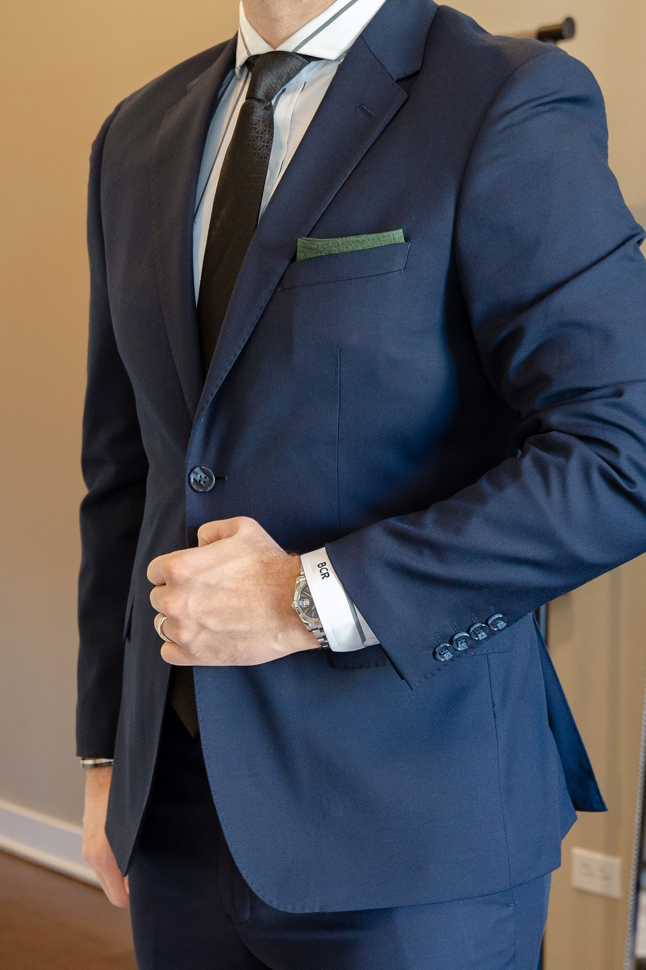 Blue blazer styled with a bold strip shirt and solid blue tie