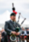 Guy in a kilt compeating in the highland games