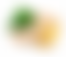 A few pieces of fresh ginger root, some of which are sliced to reveal their pale yellow interior. The ginger is accompanied by several broad, green leaves, adding a natural contrast.