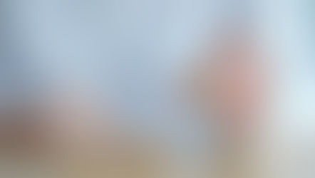 A hand picks a wooden block with a smiling face from a row of four blocks showing various emotions, set on a wooden table. Black Cohosh and St. John’s Wort for Mood Balance. Herbpy Blog.