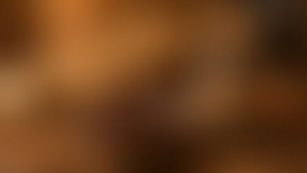 Bowl of cloves, ginger, and cinnamon sticks on a wooden table with a "Traditional Remedy" jar. Book labeled "Herbal Medicine" and lit candle in background. Warm, rustic mood. Herbpy Blog.