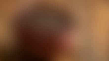 Brown bowls filled with cloves on a wooden surface. Nearby are several beige capsules, suggesting a herbal or natural theme.