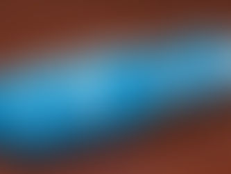 Blue capsule labeled "Zn 30 zinc," filled with Zn-marked blue balls, on a wooden surface. Clean and clinical appearance.