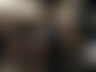 A fit man focusing on lifting weights in a gym, with a bottle of KSM-66 in the foreground, symbolizing strength and focus.