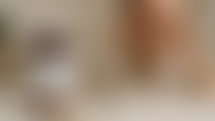 Man holding head in pain beside a bottle of magnesium glycinate, a glass of water, and pills on a table. Neutral background. Herbpy Blog.