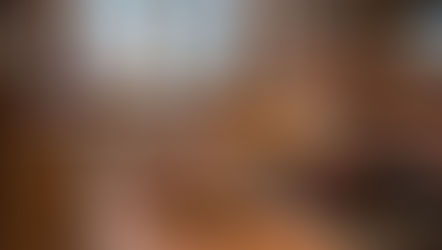 Hands sprinkle spices into a steaming copper pot on a stove in a cozy kitchen. Jars of spices and ingredients are spread on a wooden counter. Why Warm Spices Make You Feel Comforted During the Cold Season