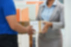 Receiving a door-to-door delivery of American products in Cuba from a Tuanigo courier.