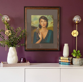 Short term rental interior styling in Nashville, TN with purple accent wall, framed art, and modern decor