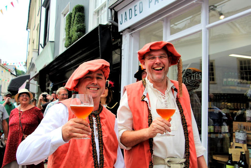 Don Distin and Calvin Giles, official Ale Tasters, solemnly undertaking their duties during the Ale Tasting and Bread Weighing Ceremony
