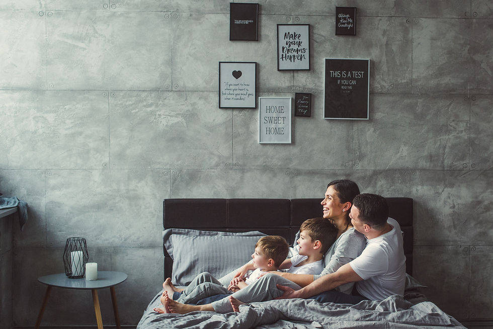 Mother, father and two sons on the bed. Christmas..jpg
