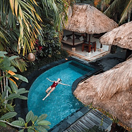 women laying in the tropical hotel pool relaxed