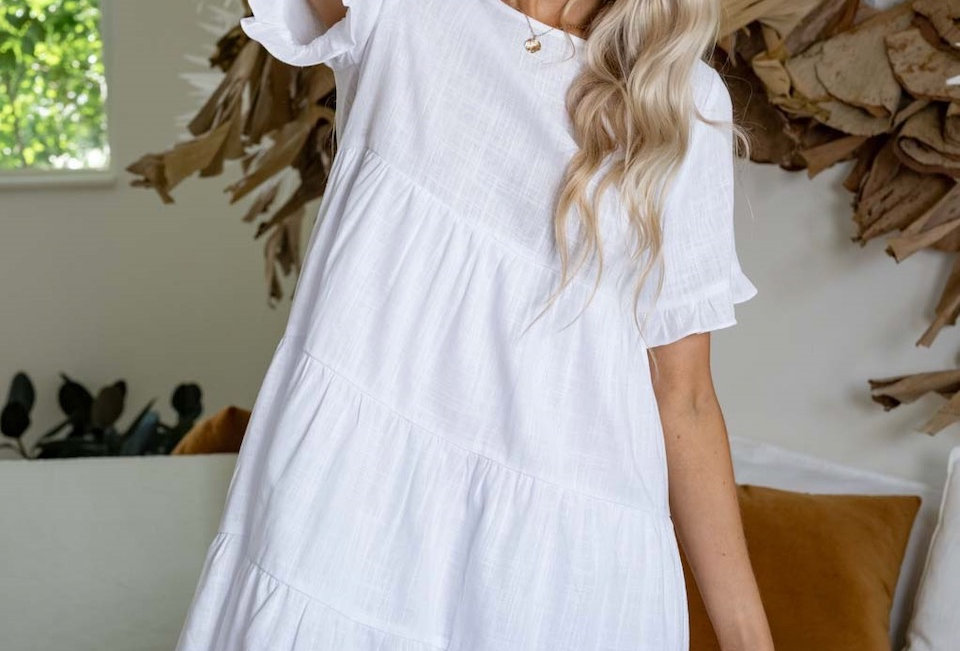 White linen mini dress, smock style Smock style Easy fit Wooden buttons at back 3/4 Sleeve with frill Pannel detail