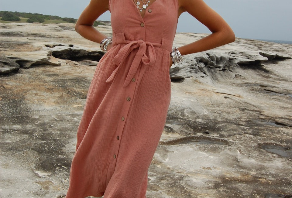 Cute linen terracotta coloured midi dress V neck line Waist tie Brown timber buttons at front V neck 30% Linen 70% Rayon Col