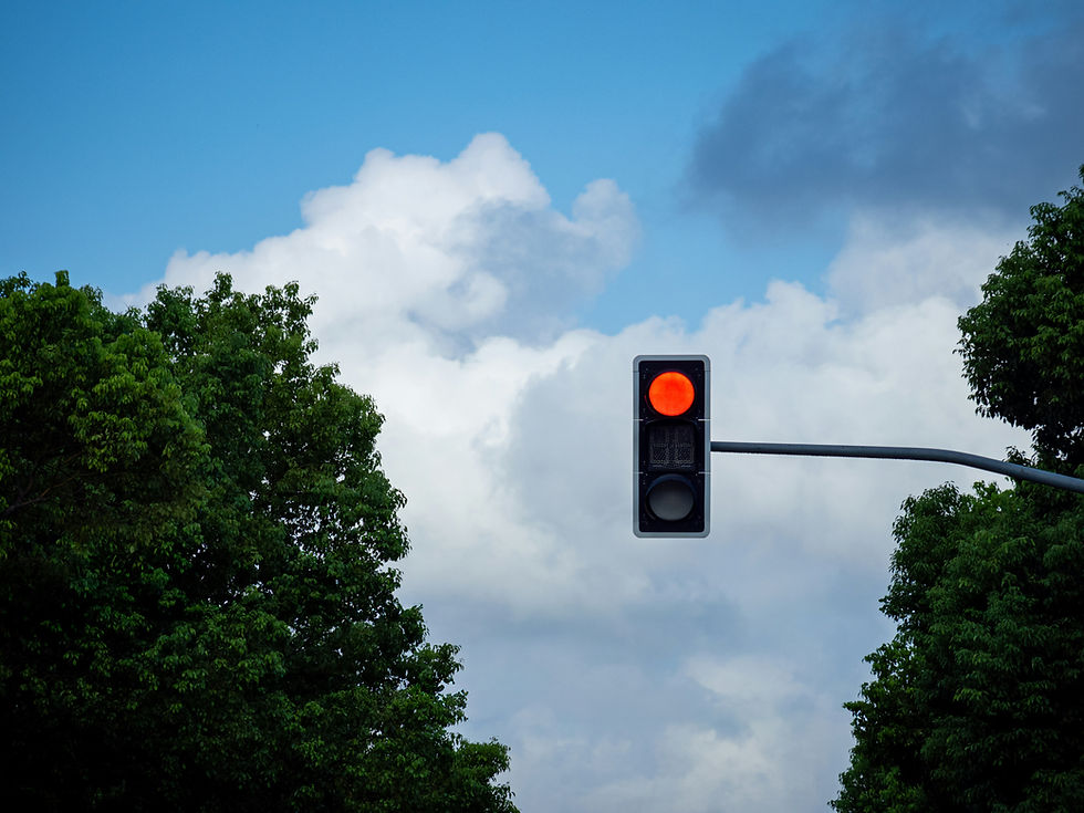 Red light against a blue sky