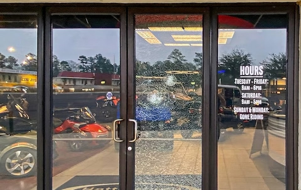 store front glass door shattered but still protected and secure because of Stanguard Security Window Film