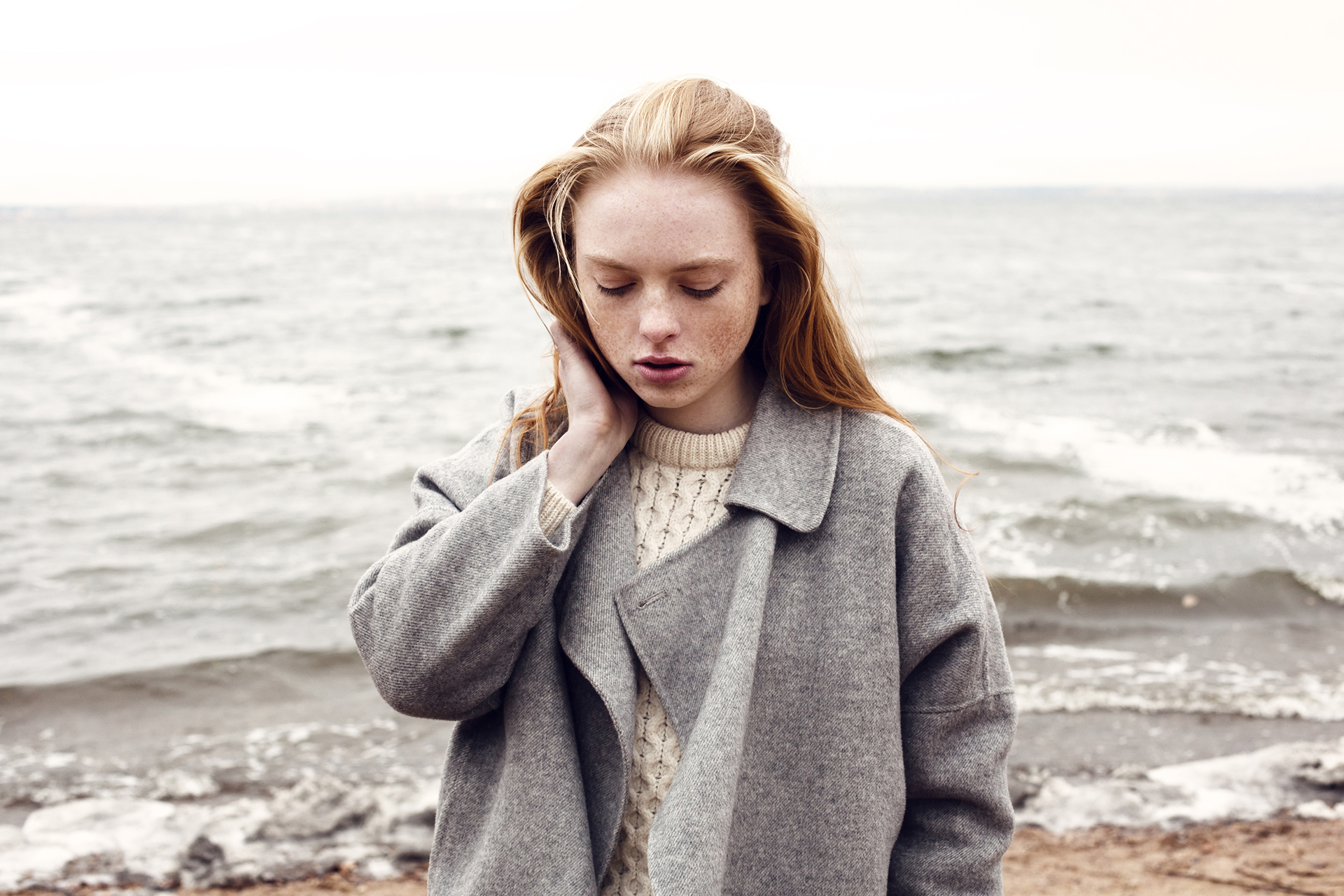 Woman by the Sea in Grey Jacket