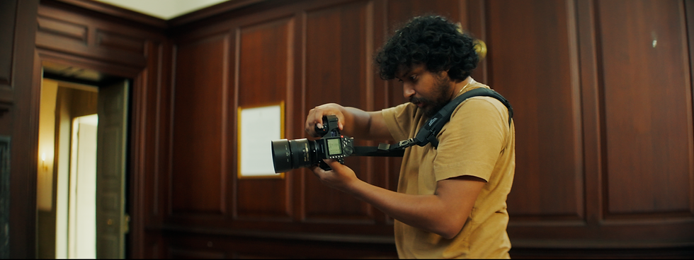 Photographer adjusting camera settings