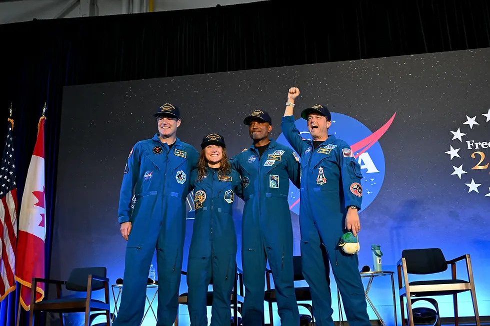 NASA’s Artemis II crew – NASA astronauts Reid Wiseman, Victor Glover, and Christina Koch, and CSA (Canadian Space Agency) astronaut Jeremy Hansen – smile at friends, family, and colleagues.