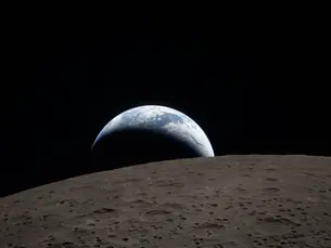 View of the Earth setting behind the Moon, taken by the Artemis II crew.