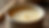 Close-up view of smooth soy wax surface in a candle container