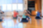 A group of people stretching.
