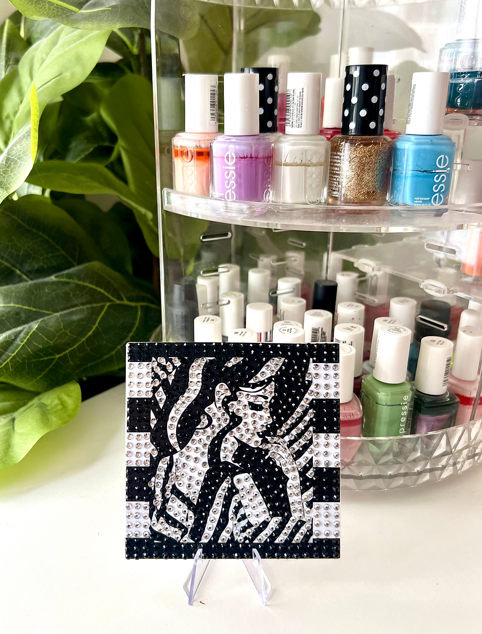 Thumbnail: Bedazzled art tiles with art deco and modern design, black and white striped background, perfect for makeup enthusiasts.