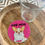 Thumbnail: pink rhinestoned background with chihuaua in the foreground