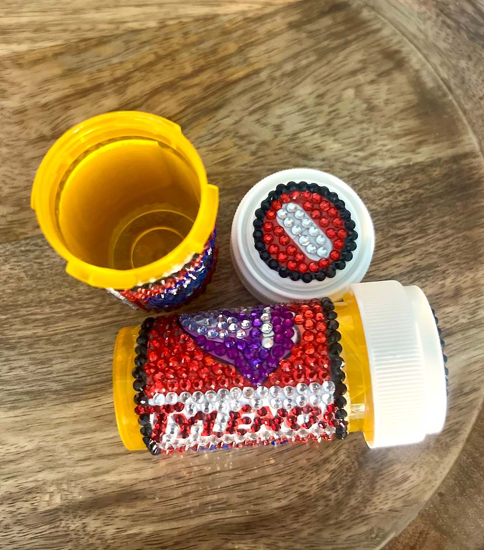 Thumbnail: tylenol pill bottle bedazzled with rhinestones, perfect for storing pain and headache pills