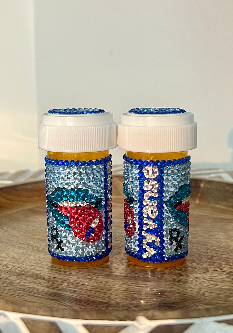 Thumbnail: bedazzled pill bottle with vibrant rhinestones and blue zircon lips design, perfect for Vyvanse. Jonathan adler pills