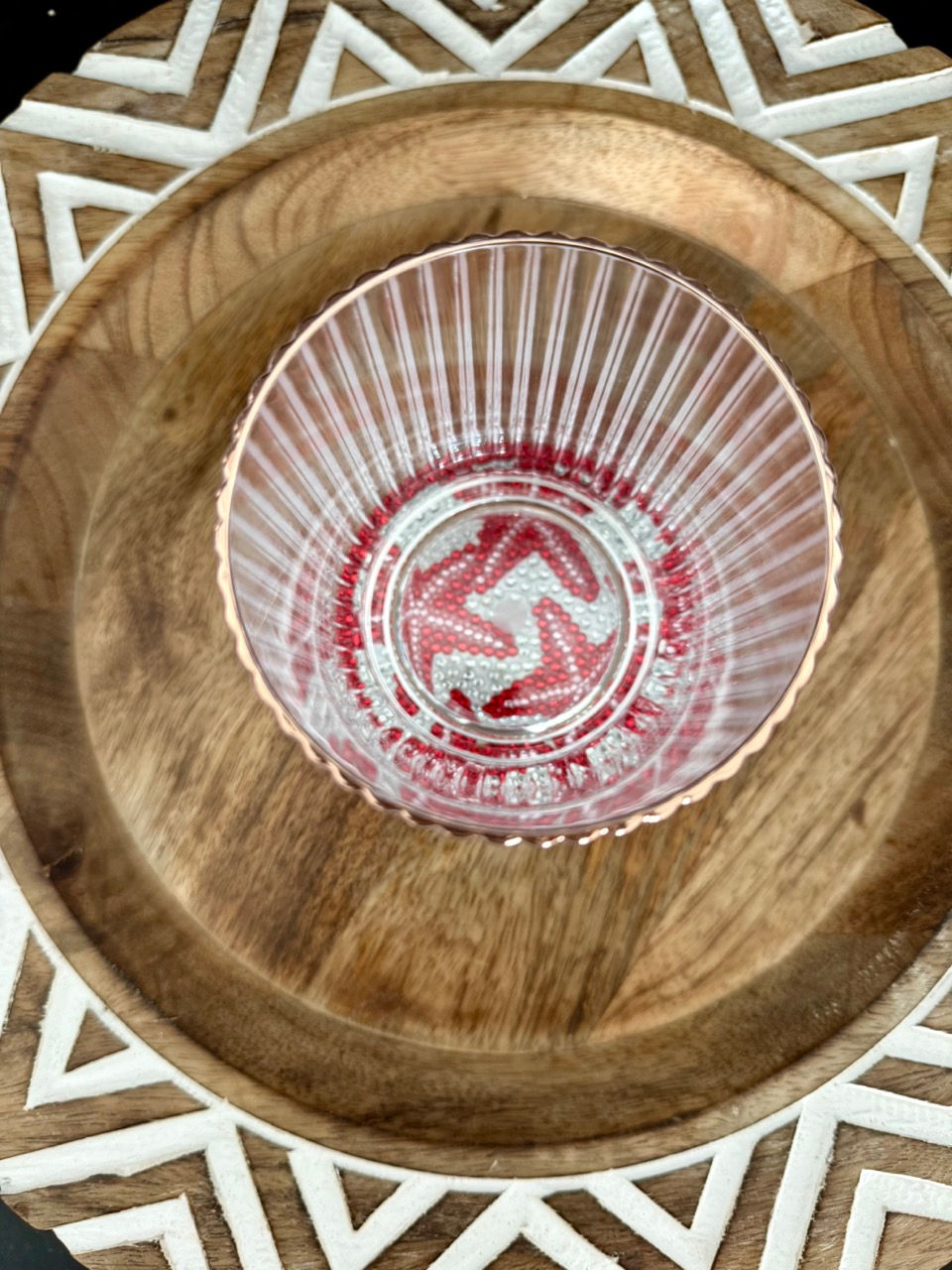 Thumbnail: A handcrafted rhinestone coaster with a red starfish design, displayed on a wooden tray with a cork backing
