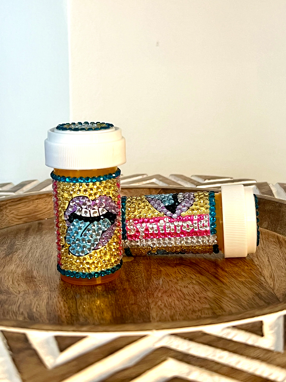 Thumbnail: pill bottle with purple lips and blue tongue design, bedazzled with rhinestones