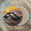 Thumbnail: Bedazzled coaster with the Anjunabeats/Anjunadeep logo on a sunset mountain design, perfect for trance music lovers and outdo