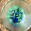 Thumbnail: Lets Par TEE written on a 4 inch acrylic round. golf cart with golfer hitting ball.
